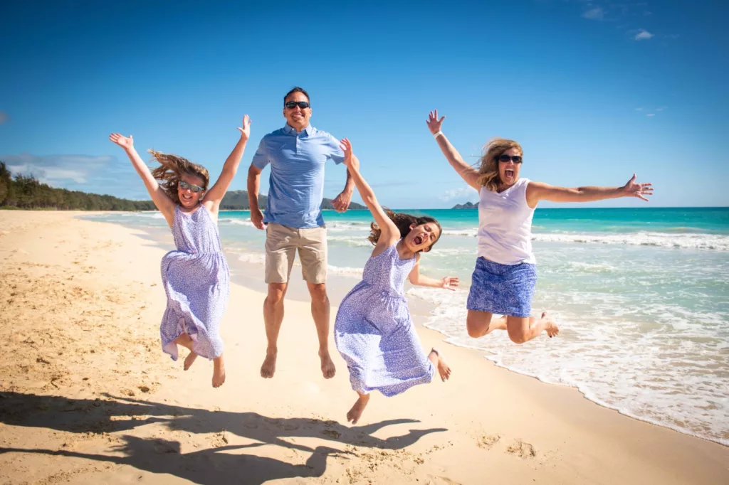 An image of a perfect family photoshoot at the beach by oahu hawaii photography