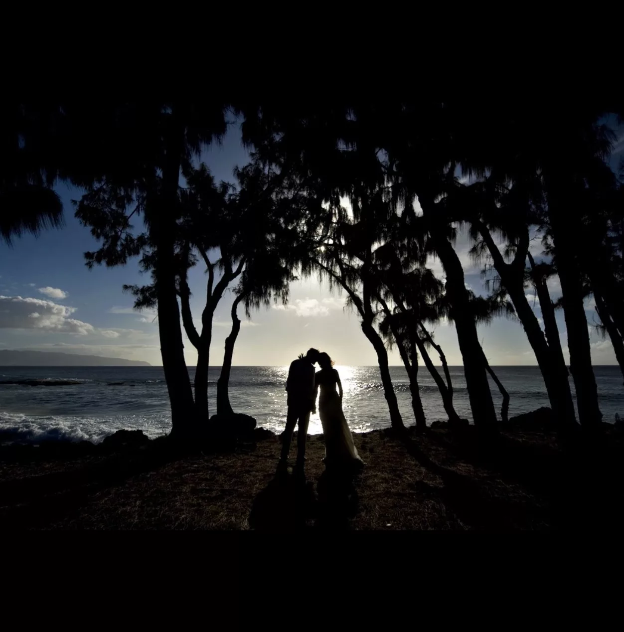 A perfect sunset beach side couple photoshoot captured by oahu hawaii photographer