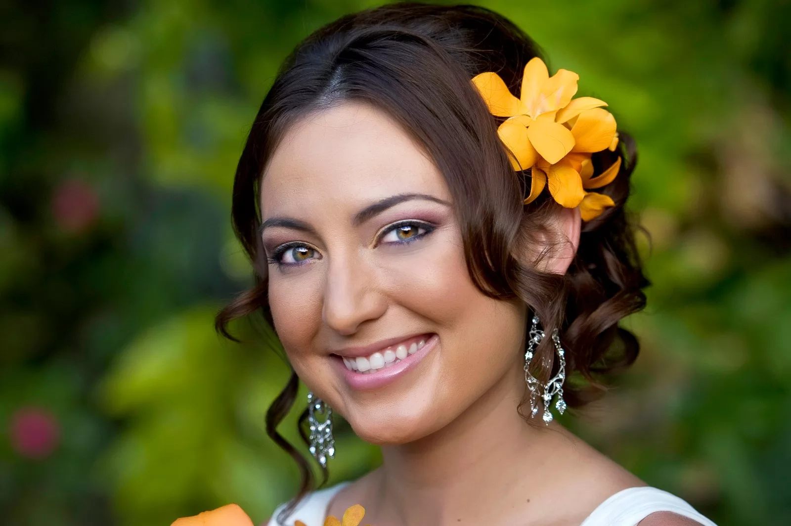an image of a woman smiling with a flower on her head taken by koolina photographer