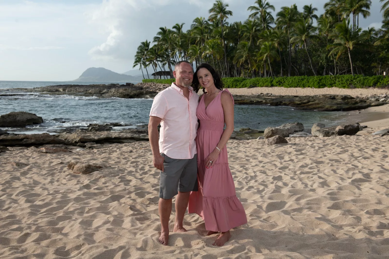 an image of a couple at the beach captured by oahu photographers