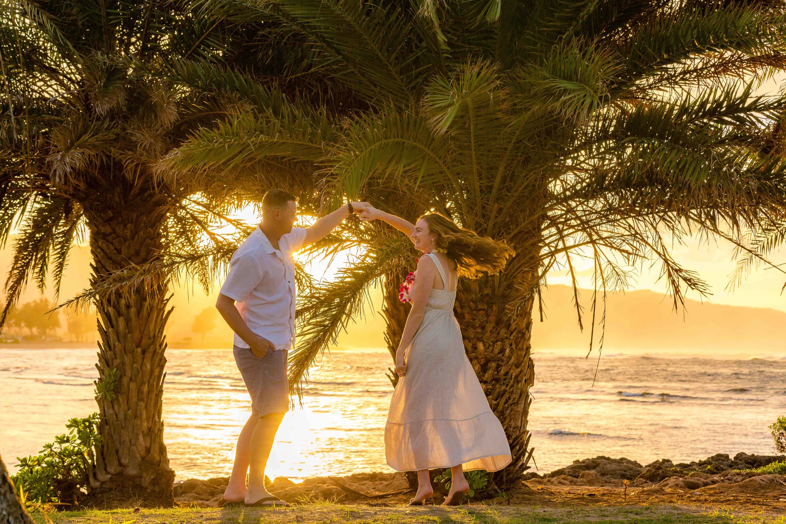 an image of a couple lovely dancing at the beach after their proposal captured by a north shore photographer